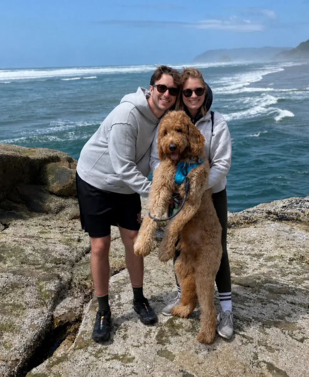 Saskia and Eli with Tucker on the coast